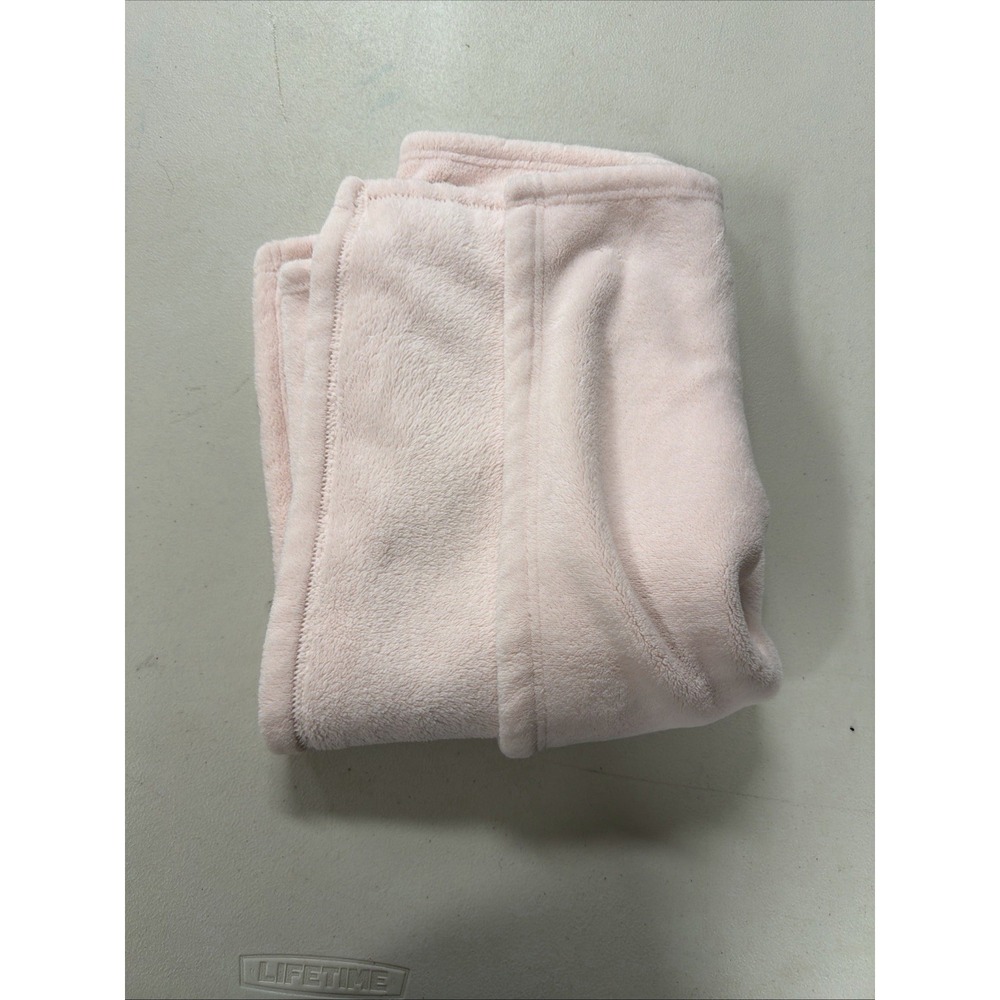 soft, light pink fleece or plush blanket